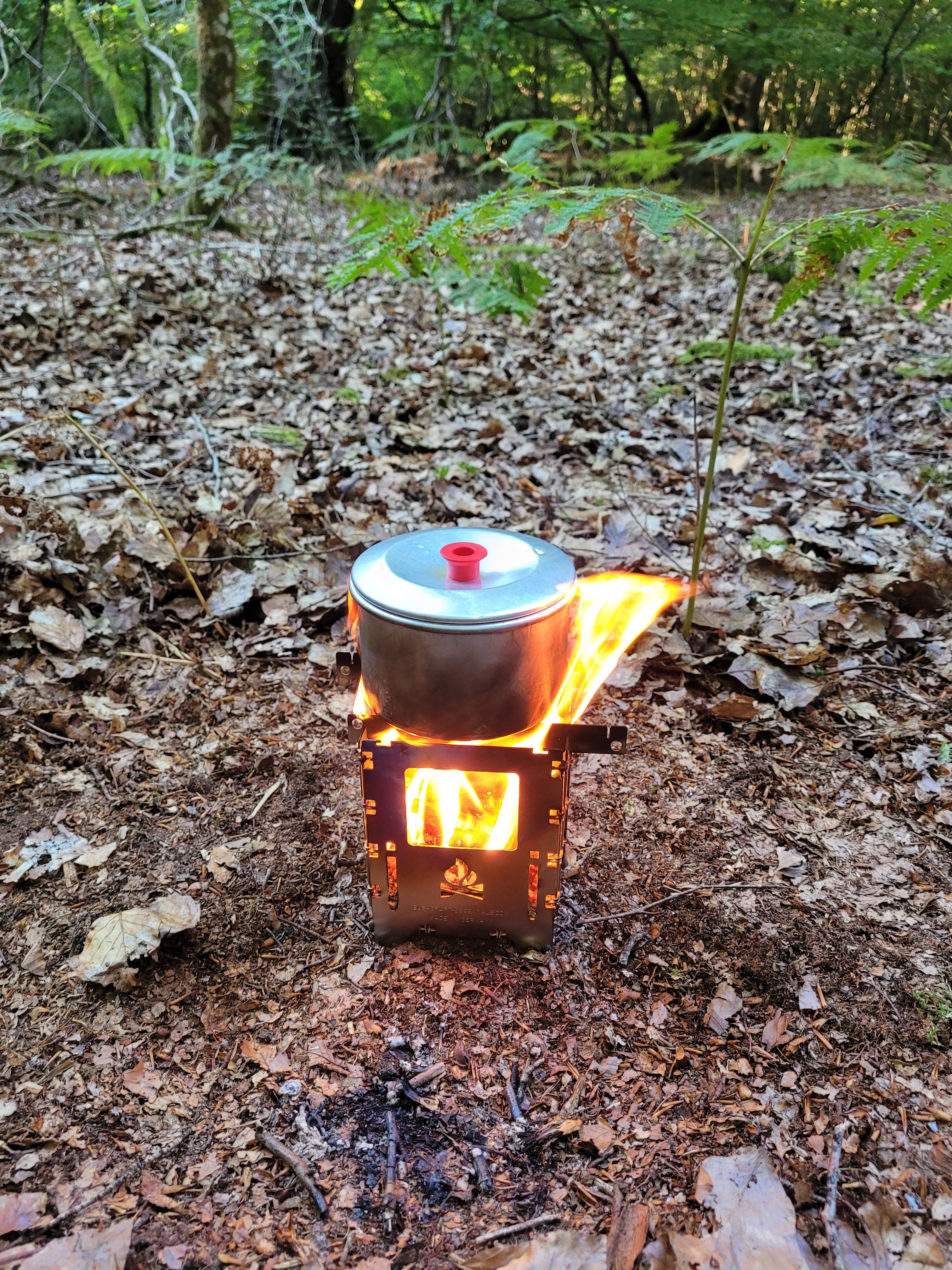 Boiling water over fire