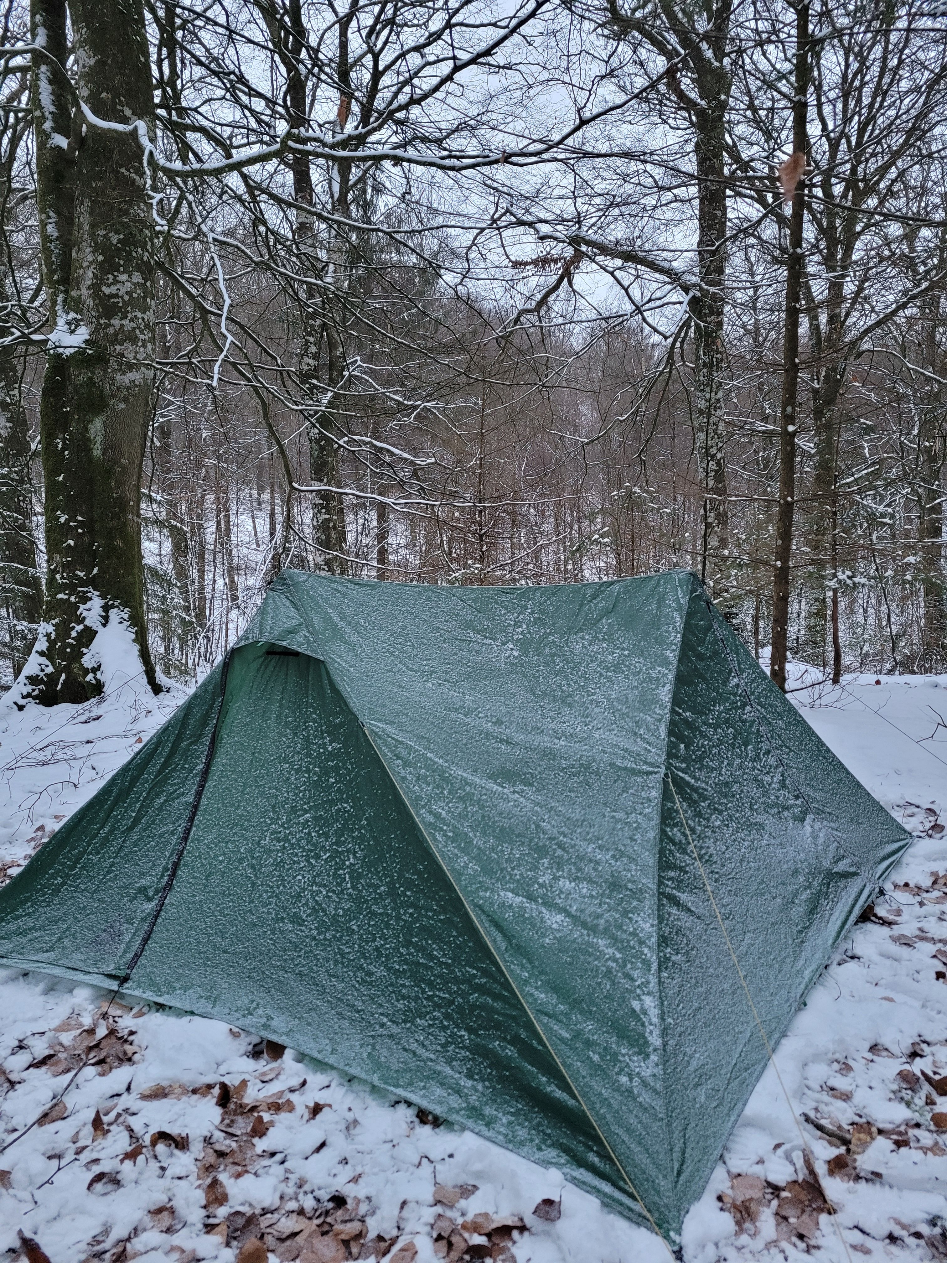 Tent covered with a bit of snow